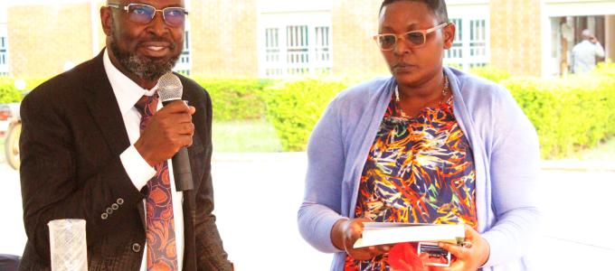 Dr. Mutyaba Imaam (L) addressing the staff of Kiryandongo District after handing over to ADHO-MCH Christine Adah (R)