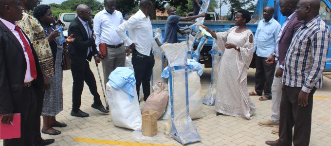 #htmlcaption-0 Kiryandongo district Members of Parliament handing over assorted Medical Equipment to the District Chairman